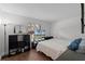 Cozy bedroom with hardwood floors, ample closet space, and natural light at 8004 Village Green Rd, Orlando, FL 32818
