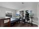 Bedroom with large window, study desk, and good natural light at 8004 Village Green Rd, Orlando, FL 32818