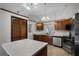 Functional kitchen with stainless steel appliances, ample counter space, and abundant natural light at 8004 Village Green Rd, Orlando, FL 32818