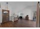 Bright living room with hardwood floors, vaulted ceilings, and a large window for natural light at 8004 Village Green Rd, Orlando, FL 32818