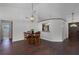 Inviting living area with hardwood floors and vaulted ceilings provides a seamless transition to other spaces at 8004 Village Green Rd, Orlando, FL 32818