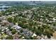An aerial view offering a look at the property's location near a picturesque lake and the city skyline, highlighting its prime location at 833 Dartmouth St, Orlando, FL 32804
