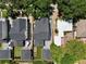 An aerial view displaying the home, driveway, and backyard with turf and a deck with lounge chairs at 833 Dartmouth St, Orlando, FL 32804