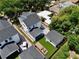 A high angle aerial of the property showing the backyard, fence line, and location within the neighborhood at 833 Dartmouth St, Orlando, FL 32804