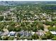 A serene aerial view showing the house surrounded by lush greenery in a residential neighborhood, offering peace and tranquility at 833 Dartmouth St, Orlando, FL 32804