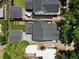 Aerial view of the home highlighting the landscaped backyard with a deck and the driveway at 833 Dartmouth St, Orlando, FL 32804
