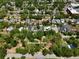 Beautiful aerial view of the property located next to Dartmouth Park with many mature trees at 833 Dartmouth St, Orlando, FL 32804