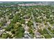 An aerial view illustrating the property's place within a verdant community, promoting a lifestyle of suburban charm and accessibility at 833 Dartmouth St, Orlando, FL 32804