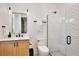 Bright bathroom featuring a sleek glass shower, subway tile walls, and a modern vanity with stylish fixtures at 833 Dartmouth St, Orlando, FL 32804
