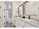 Bathroom featuring double sinks, granite countertops and bath tub with shower at 833 Dartmouth St, Orlando, FL 32804