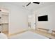 Minimalist bedroom with light wood floors, bench seating and closet at 833 Dartmouth St, Orlando, FL 32804