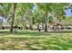 A well-manicured community park with picnic tables and mature shade trees at 833 Dartmouth St, Orlando, FL 32804
