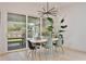 Dining area features a modern light fixture and sliding glass doors to the outdoor space at 833 Dartmouth St, Orlando, FL 32804