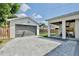 Home featuring pavers, backyard, garage and outdoor kitchen at 833 Dartmouth St, Orlando, FL 32804