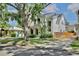 Beautiful two-story home featuring modern architecture and a well-maintained lawn, complemented by a mature tree at 833 Dartmouth St, Orlando, FL 32804