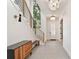 Modern foyer with a staircase, unique lighting fixtures, and herringbone tile flooring creating a stylish entrance at 833 Dartmouth St, Orlando, FL 32804