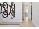 Hallway with hardwood floors and view of stairs and bikes mounted on the wall at 833 Dartmouth St, Orlando, FL 32804