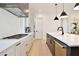 Modern kitchen features gas range, stainless steel appliances, bright white countertops, and an eat-in island at 833 Dartmouth St, Orlando, FL 32804