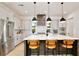 Modern kitchen featuring a large island with seating, stainless steel appliances, and sleek cabinetry at 833 Dartmouth St, Orlando, FL 32804
