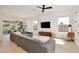 Bright living room has large windows, a modern sectional sofa, and contemporary decor at 833 Dartmouth St, Orlando, FL 32804