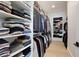 Organized walk-in closet with custom shelving and ample storage space for clothes and accessories at 833 Dartmouth St, Orlando, FL 32804