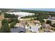 Aerial view of homes in a residential area with mature trees and landscaping at 857 E Flag Ln, Kissimmee, FL 34759