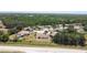 Wide aerial view showing a residential area with diverse homes and mature trees at 857 E Flag Ln, Kissimmee, FL 34759