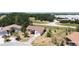 Aerial view of homes in a residential area with mature trees and landscaping at 857 E Flag Ln, Kissimmee, FL 34759
