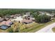 Aerial view of the home situated in a quiet neighborhood with mature trees at 857 E Flag Ln, Kissimmee, FL 34759