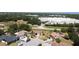 Aerial view of homes in a residential area with mature trees and landscaping at 857 E Flag Ln, Kissimmee, FL 34759