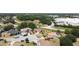 Aerial view of homes in a residential area with mature trees and landscaping at 857 E Flag Ln, Kissimmee, FL 34759