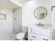 Modern bathroom featuring tiled shower, black fixtures, and floating vanity at 857 E Flag Ln, Kissimmee, FL 34759