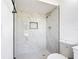 Contemporary bathroom showcasing tiled shower and modern fixtures at 857 E Flag Ln, Kissimmee, FL 34759
