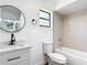 Updated bathroom features tile surround, modern vanity and plenty of light at 857 E Flag Ln, Kissimmee, FL 34759
