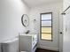 Modern bathroom featuring vanity with a vessel sink, and tiled floors at 857 E Flag Ln, Kissimmee, FL 34759