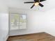 Inviting bedroom featuring modern ceiling fan and bright natural lighting at 857 E Flag Ln, Kissimmee, FL 34759