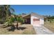 Charming single-story home featuring desert landscaping and a single-car garage at 857 E Flag Ln, Kissimmee, FL 34759