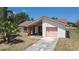Charming one-story home featuring a single-car garage and neutral exterior paint at 857 E Flag Ln, Kissimmee, FL 34759