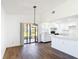 Open concept kitchen and dining area with natural light at 857 E Flag Ln, Kissimmee, FL 34759