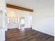 Open living room with dark floors and multiple access points at 857 E Flag Ln, Kissimmee, FL 34759