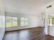 Bright, open living room with modern flooring and large windows at 857 E Flag Ln, Kissimmee, FL 34759
