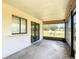View of the covered and screened patio featuring outdoor access and space for entertaining at 857 E Flag Ln, Kissimmee, FL 34759