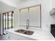 Updated kitchen sink featuring modern faucet, and bright natural lighting at 857 E Flag Ln, Kissimmee, FL 34759
