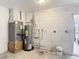 Utility room featuring water heater and HVAC system at 857 E Flag Ln, Kissimmee, FL 34759