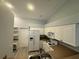 Kitchen features white cabinets, and a full suite of appliances plus a refrigerator with water dispenser at 8829 Courtyard Ln, Groveland, FL 34736