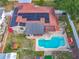 A tranquil backyard with a sparkling swimming pool and a manicured lawn offers relaxation and privacy at 898 Hendry Dr, Orlando, FL 32822