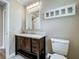 Charming bathroom features a dark wood vanity with a white countertop and medicine cabinet at 898 Hendry Dr, Orlando, FL 32822