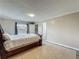 Bedroom with tile flooring, modern neutral walls, and a view of the fenced backyard at 898 Hendry Dr, Orlando, FL 32822