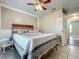 Comfortable bedroom with tile flooring and modern ceiling fan fixture at 898 Hendry Dr, Orlando, FL 32822