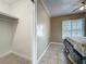 Bedroom with closet, tiled floor, and bright window view at 898 Hendry Dr, Orlando, FL 32822